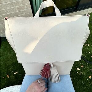 Kate Spade cream and burgundy leather tassel backpack